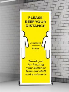 Roller Banner Stand Pop-up for Social Distancing in Operation | 2 Metres (6 Feet). Bespoke designs available on request.