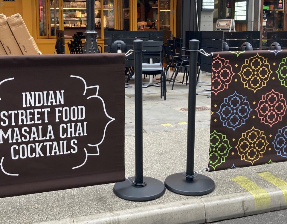 Papa Dum Restaurant in London City Centre. Indian street food cuisine in the capital of England. Bespoke branding for the awning, valance and cafe barrier banners all over printing in full colour by Parker Masters Ltd.